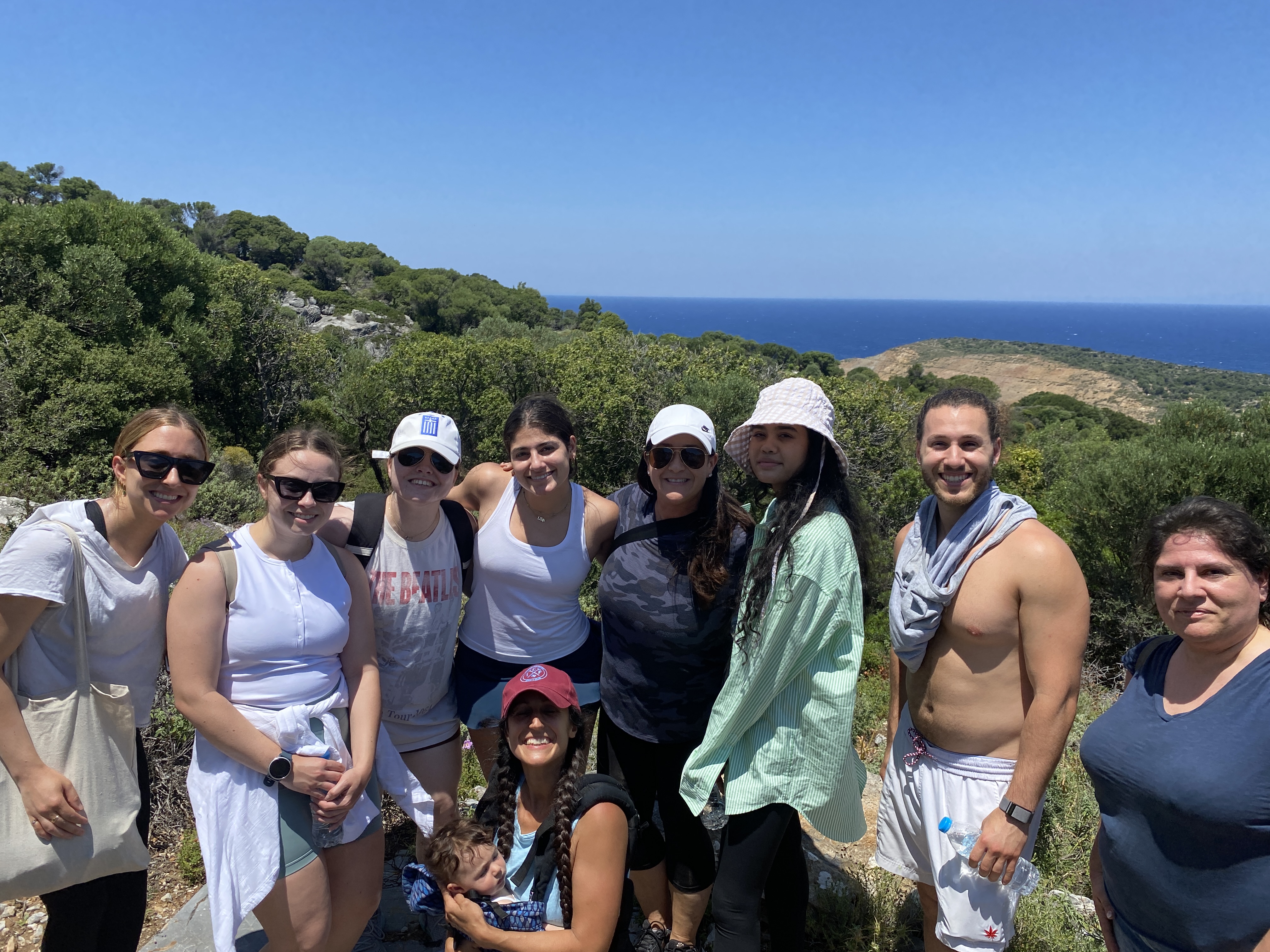 Nutrition sciences and nursing students standing on a mountainside after a hike.
